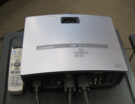 Picture of the projector and the projector's remote control